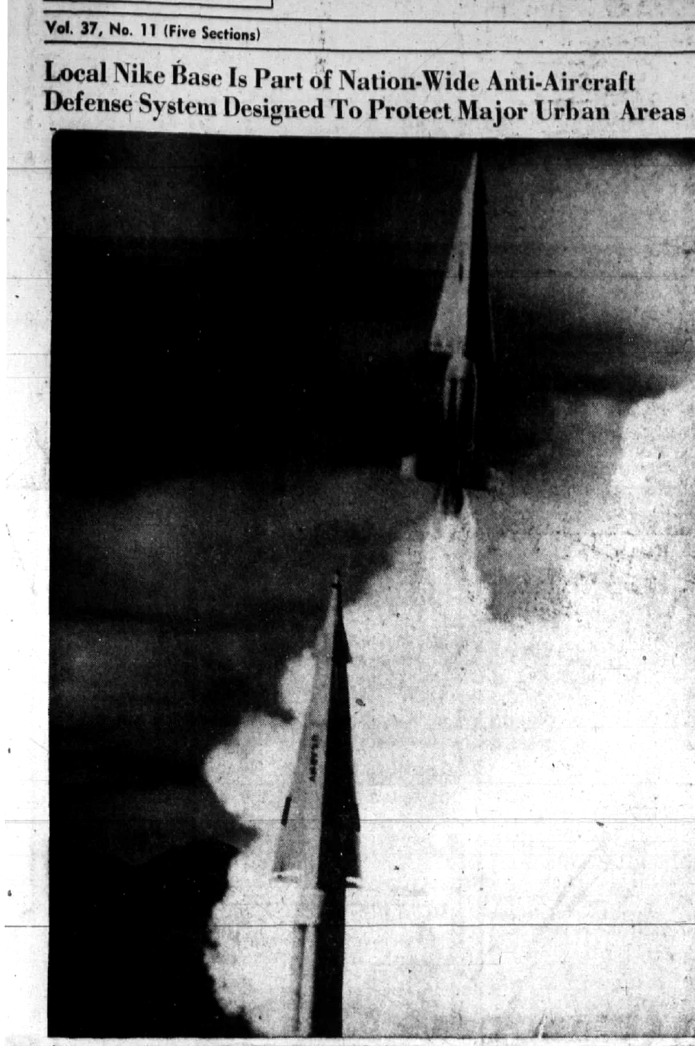 1967 newspaper photo of a Nike missile launching in a cloud of smoke